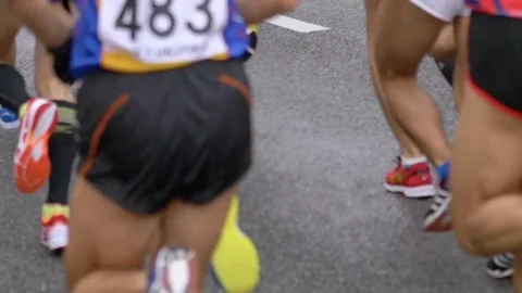 Marathon runners legs in slow motion Stock Footage 77417499