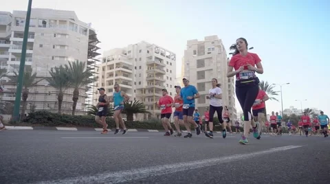 Marathon runners from low angle view Stock Footage 60744376