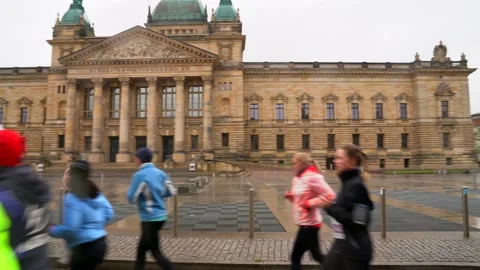 Marathon runners on a rainy day in Leipzig, Germany Stock Footage 205002002