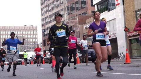 Marathon runners running on Toronto Yonge street Stock Footage 50489617