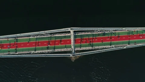 Marathon running on the footbridge. Spin top view shot Video stock 106526630