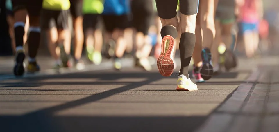 Marathon running in the light of evening Stock Photos
