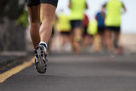 Marathon running in the light of evening Stock Photos