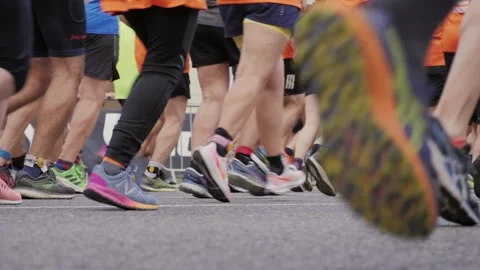 Marathon start, running people, crowd of people start run, close up of legs with Stock Footage 252761151