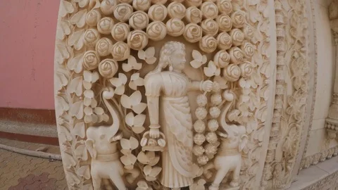 Marble bas-relief with image of girl among roses and elefants Karni Mata Temple  Stock Footage 90773852