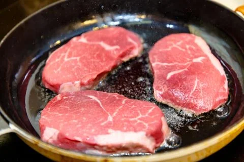 Marble beef eye of Round Steak on white background Stock Photos