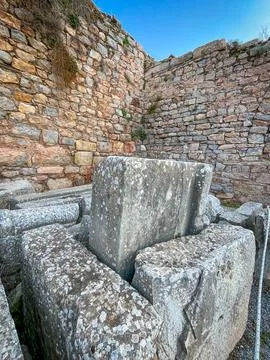 Marble Blocks Stack Against Ochre Polygonal Wall Corner Stock-Fotos