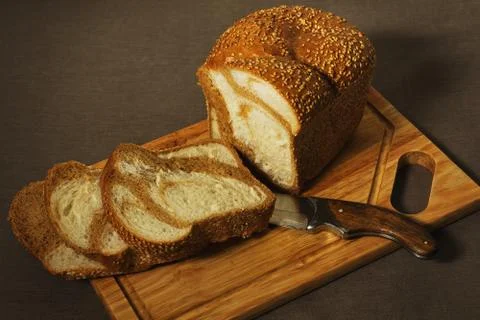 Marble bread sliced with an old knife Stock Photos