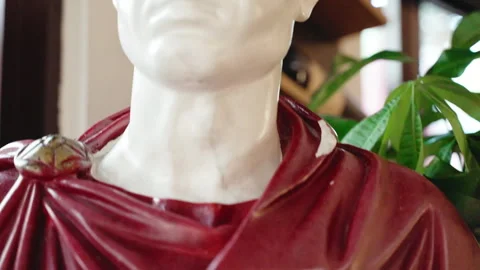 Marble bust of powerful Emperor Julius Caesar, sculpture of historical leader of Stock Footage 264054213
