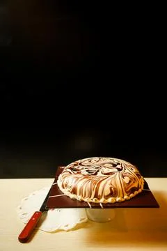 Marble Cake include chocolate, cream, sugar with knife served on board side.. Stock Photos