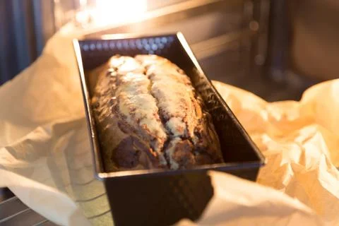 Marble cake in the oven Stock Photos