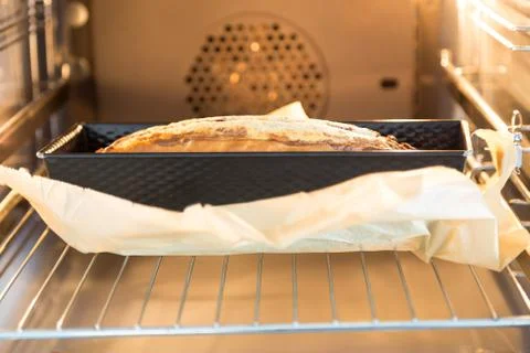 Marble cake in the oven Stock Photos
