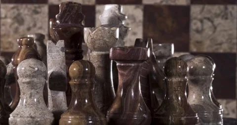 Marble chess set displayed on a patterned board Stock Footage 340482722