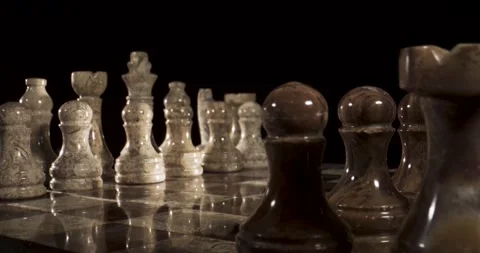 Marble chess set with various pieces on a dark background Stock Footage 340482661