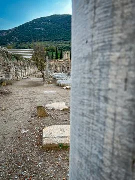 Marble Column Frames Ephesus Agora Ruins and Green Hillside Stock Photos