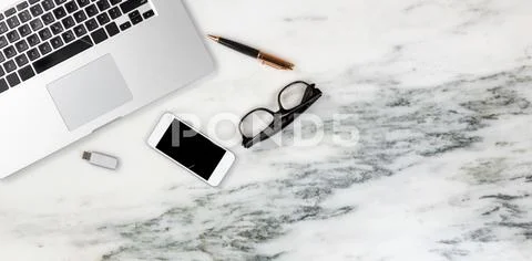 Marble desktop setting with modern mobile devices Stock Photos