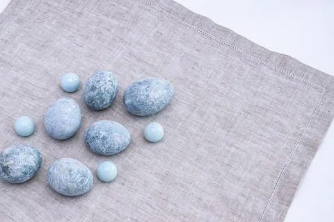 Marble Easter eggs on a gray linen napkin. Easter greeting card. Stock Photos
