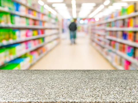 Marble empty table in front of blurred supermarket Фото