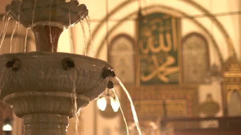 A marble fountain and ablution basin appear inside Bursa Ulu - Ablution Area Stock Footage 340524225