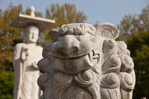 Marble lion with buddha Stock Photos