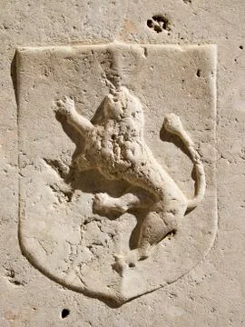 Marble lion on shield Stock Photos