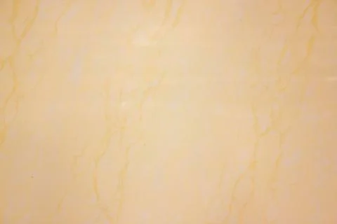 Marble pattern texture in warm yellow tones Stock Photos