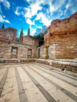 Marble Pavement Patterns Lead to Arched Stone Doorways in Ephesus Ruins 스톡 사진