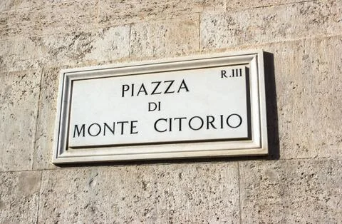 Marble plaque stating the square of monte citorio Stock Photos