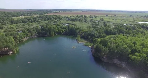 Marble quarry. Small lake in the forest. Aerial view from the top. Stock Footage 78300558