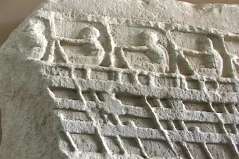 Marble relief sculpture depicting sailors rowing on an ancient ship (Trireme?) Stock Footage