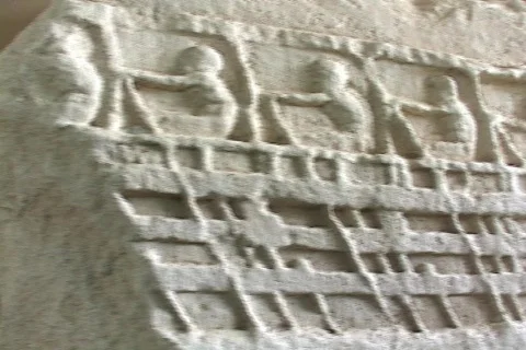Marble relief sculpture depicting sailors rowing on an ancient ship (Trireme?) Stock Footage