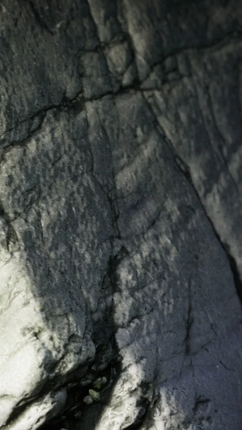 Marble rock surface pattern in a natural setting during daylight hours Stock Footage 335965653