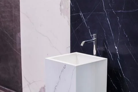 Marble sink on the background of a marble wall, black white bathroom complete Stock Photos