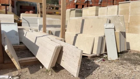 Marble slabs arranged in outdoor storage at a construction site, showcasing.. Stock Footage 329467633
