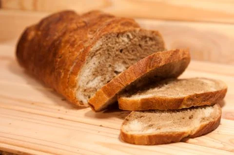 Marble sliced ??wheat - rye bread on a wooden board Stock Photos