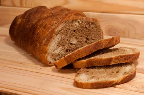 Marble sliced ??wheat - rye bread on a wooden board Stock Photos