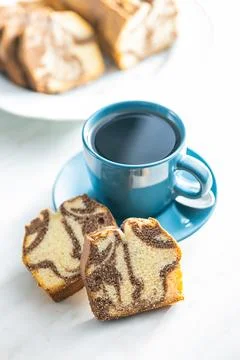 Marble sponge cake and coffee cup. Cake with cocoa and vanilla taste. Stock Photos