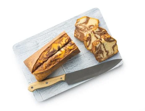 Marble sponge cake. Cake with cocoa and vanilla taste on cutting board isol.. Stock Photos