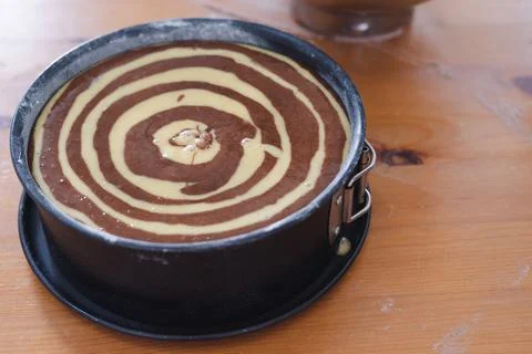 Marble sponge cake elaboration process. Copy space. Pastry. Stock Photos