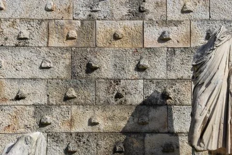 Marble statue and textured wall Stock Photos