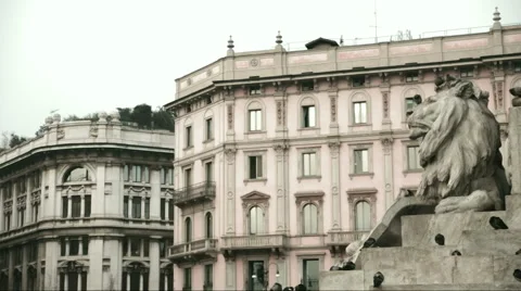 The marble statue of a lion in the background and some historic buildings Stock Footage 58213682