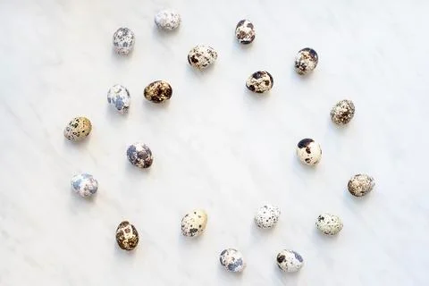 Marble surface with quail eggs and blank space for writing Stock Photos