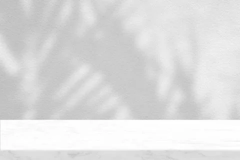 Marble Table with Coconut Leaves Shadow on Concrete Wall Texture Background Stock Photos