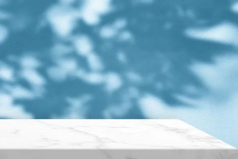 Marble Table Corner with Shadow and Spotlight on the Blue Concrete Wall. Stock Photos