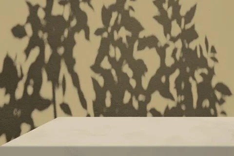 Marble Table Corner with Shadow on the Beige Concrete Wall. Stock Photos
