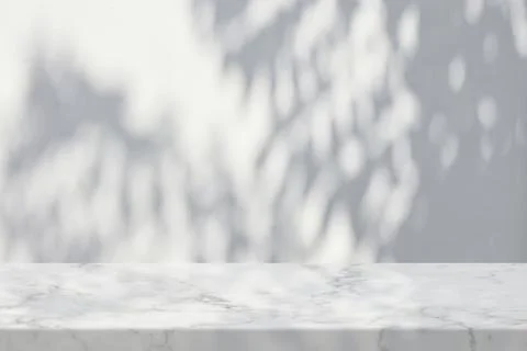 Marble Table with Leaves Shadow on Sand Wall Texture Background Stock Photos