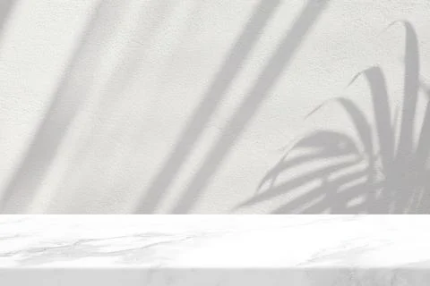 Marble Table with Leaves Shadow on Stucco Wall Texture Background Stock Photos