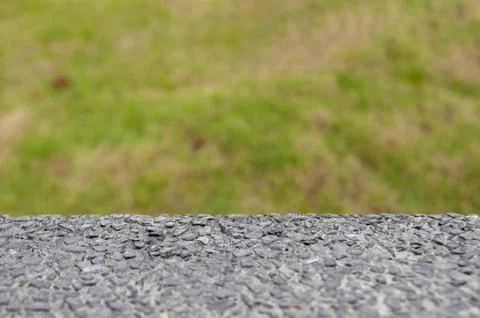 Marble table top with grass background with customizable space for mock-up Stock Photos