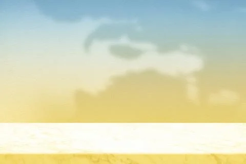 Marble Table Top with Sun Shade and Blue Yellow Gradient Wall Background Foto stock