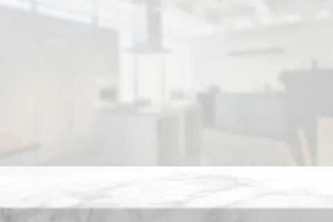 Marble Table with White Blurred Modern Kitchen Background Stock Photos